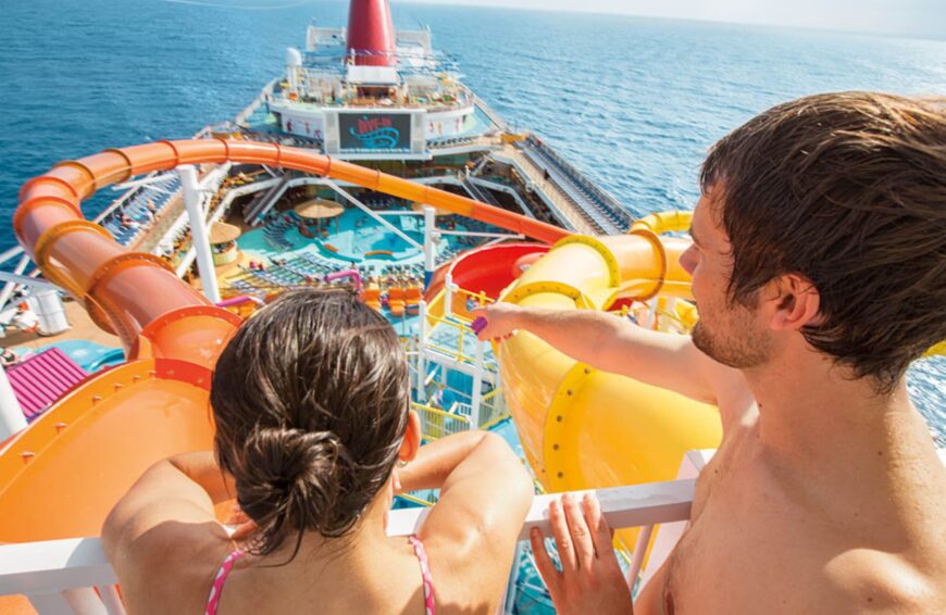 A couple on the Carnival Splendor with waterslide