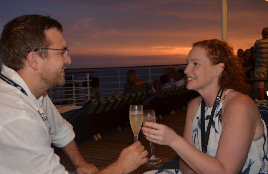 Deb and Matt cheers to their new engagement on deck on cruise proposal.