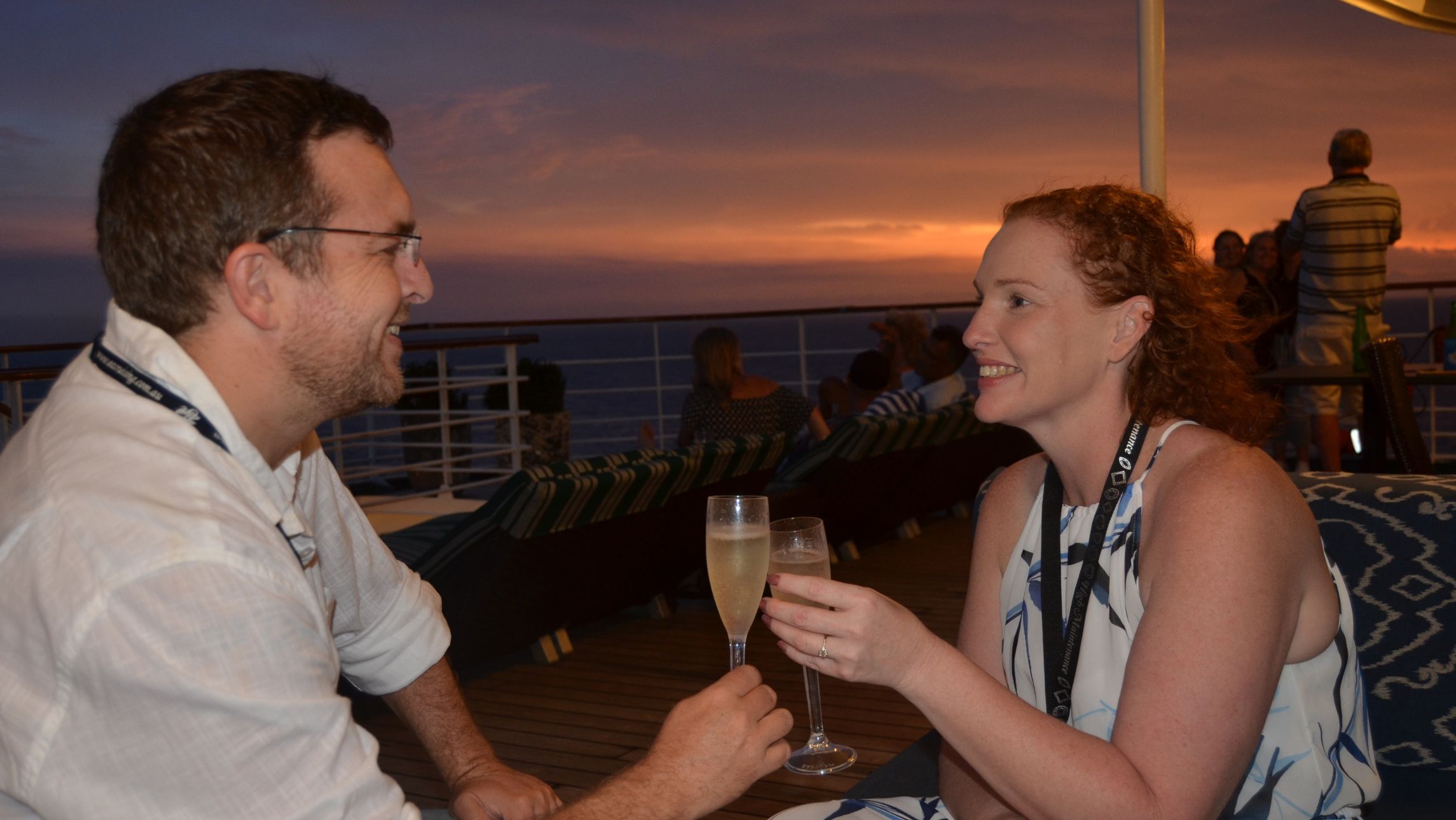 Deb and Matt cheers to their new engagement on deck on cruise proposal.
