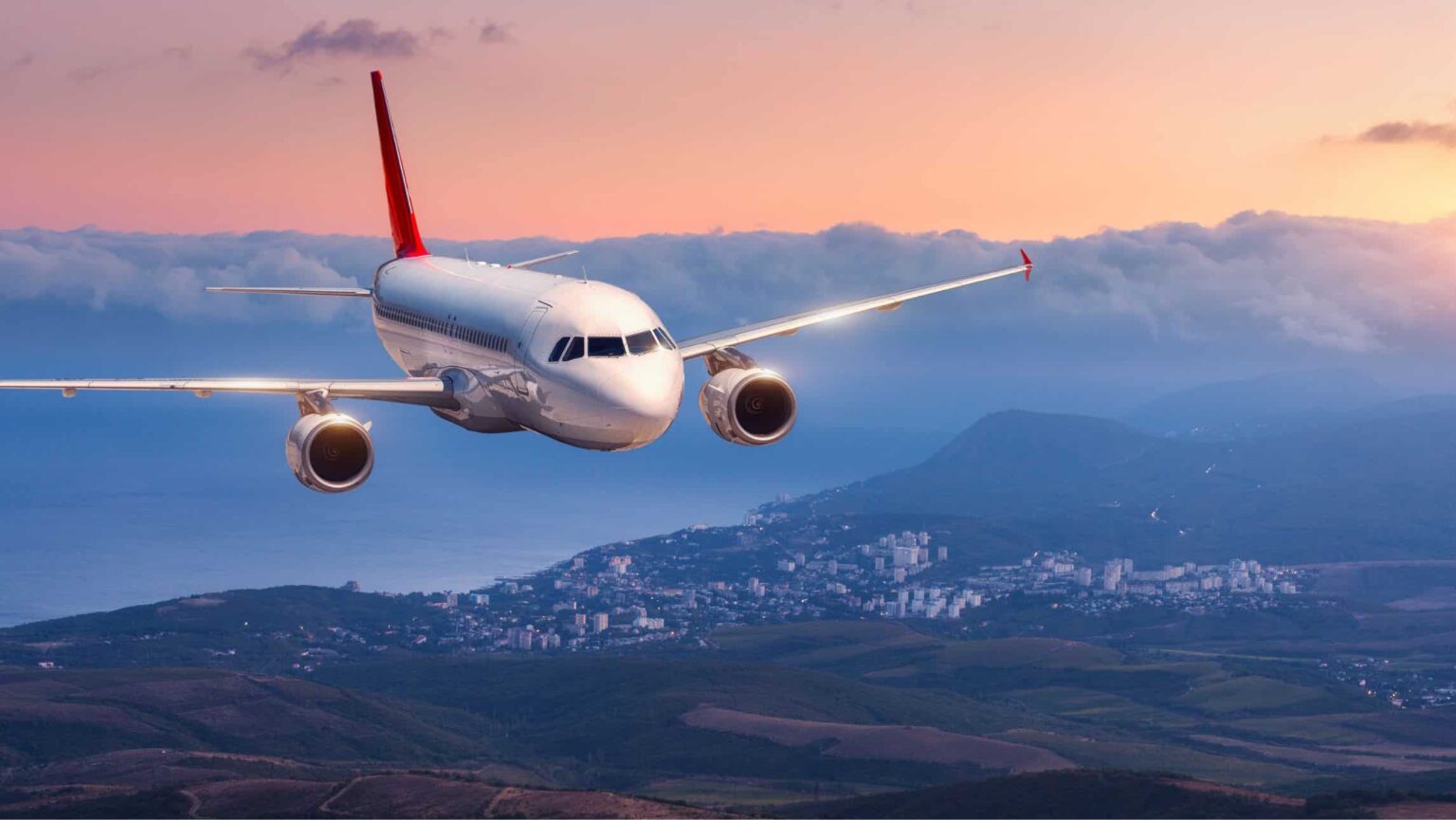 A plane flies in the sky with cruise and fly packages