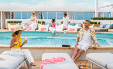 a group of people sitting on a pool deck