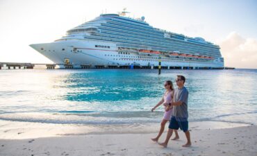 Should cruisers take up credit card travel insurance? Couple with a cruise ship