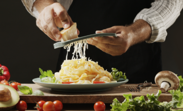 Grating cheese on fresh pasta