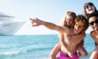 Young cruises embrace while ashore.
