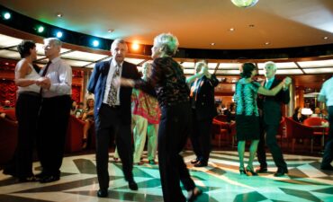 People dancing on a cruise ship.