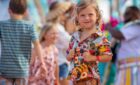 A young Royal Caribbean passenger smiles for a photo.