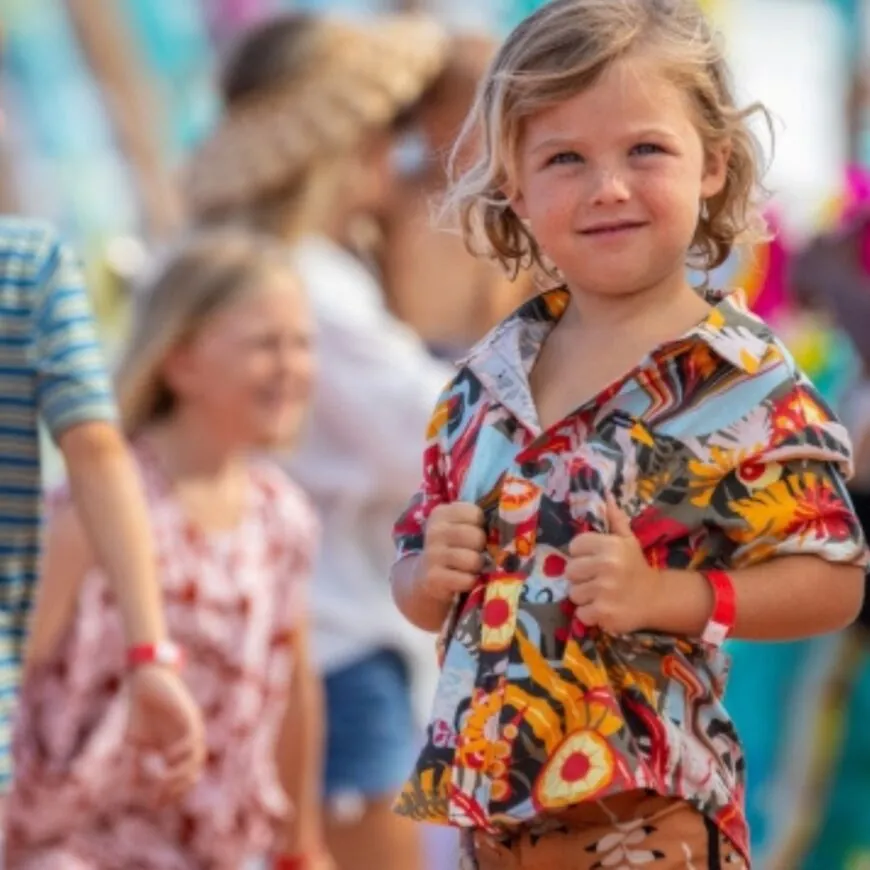 A young Royal Caribbean passenger smiles for a photo.