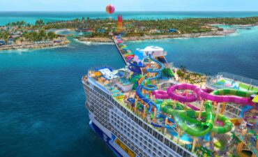 Star of the Seas Royal Caribbeans new ship sailing by an island.