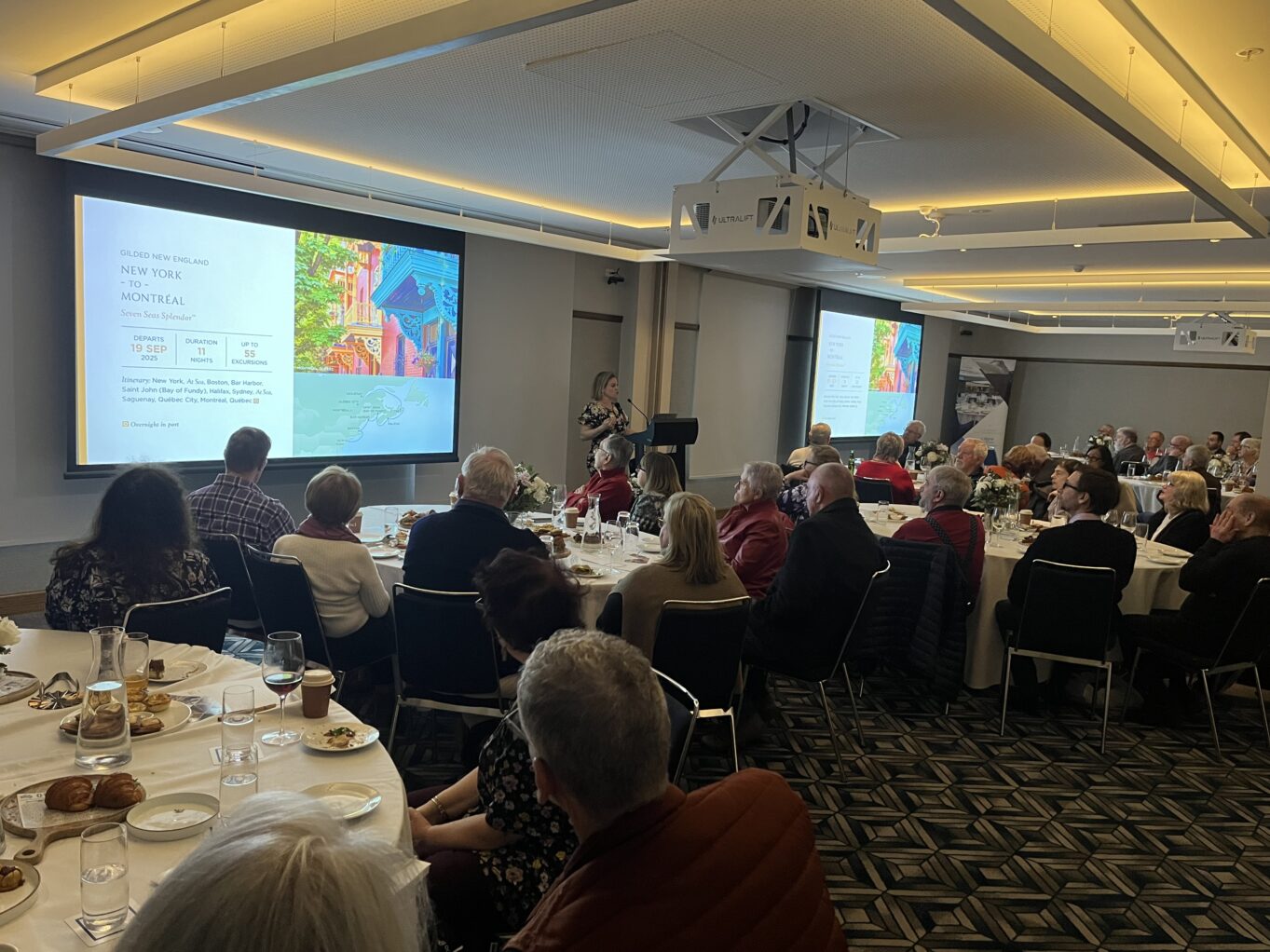 Elsa McClean presenting at the Hilton Melbourne for Regent Seven Seas Cruises