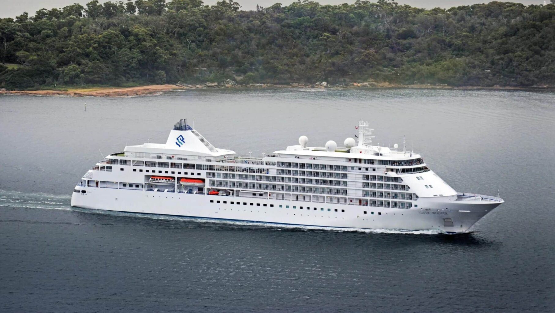 The Silver Muse in Sydney Harbour with the Sydney Harbour Bridge in the background