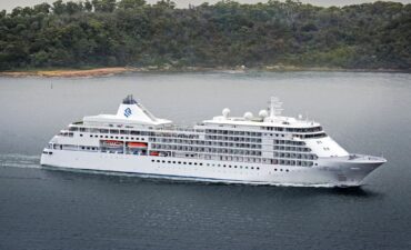 The Silver Muse in Sydney Harbour with the Sydney Harbour Bridge in the background