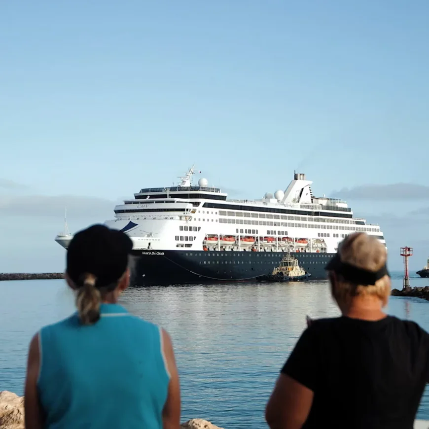 Two passengers in Geraldton looking at a cruise ship.