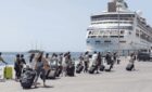Passengers taking luggage to board Vision of the Seas