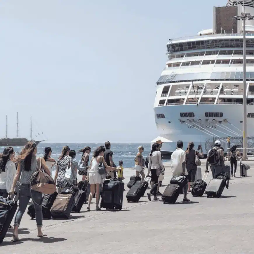 Passengers taking luggage to board Vision of the Seas