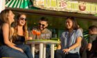 Royal Caribbean passengers enjoying a drink together.