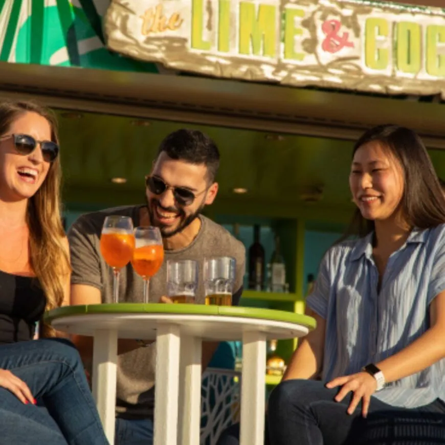 Royal Caribbean passengers enjoying a drink together.