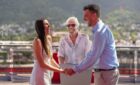 Richard Branson officiating a wedding onboard a Virgin Voyages cruise.