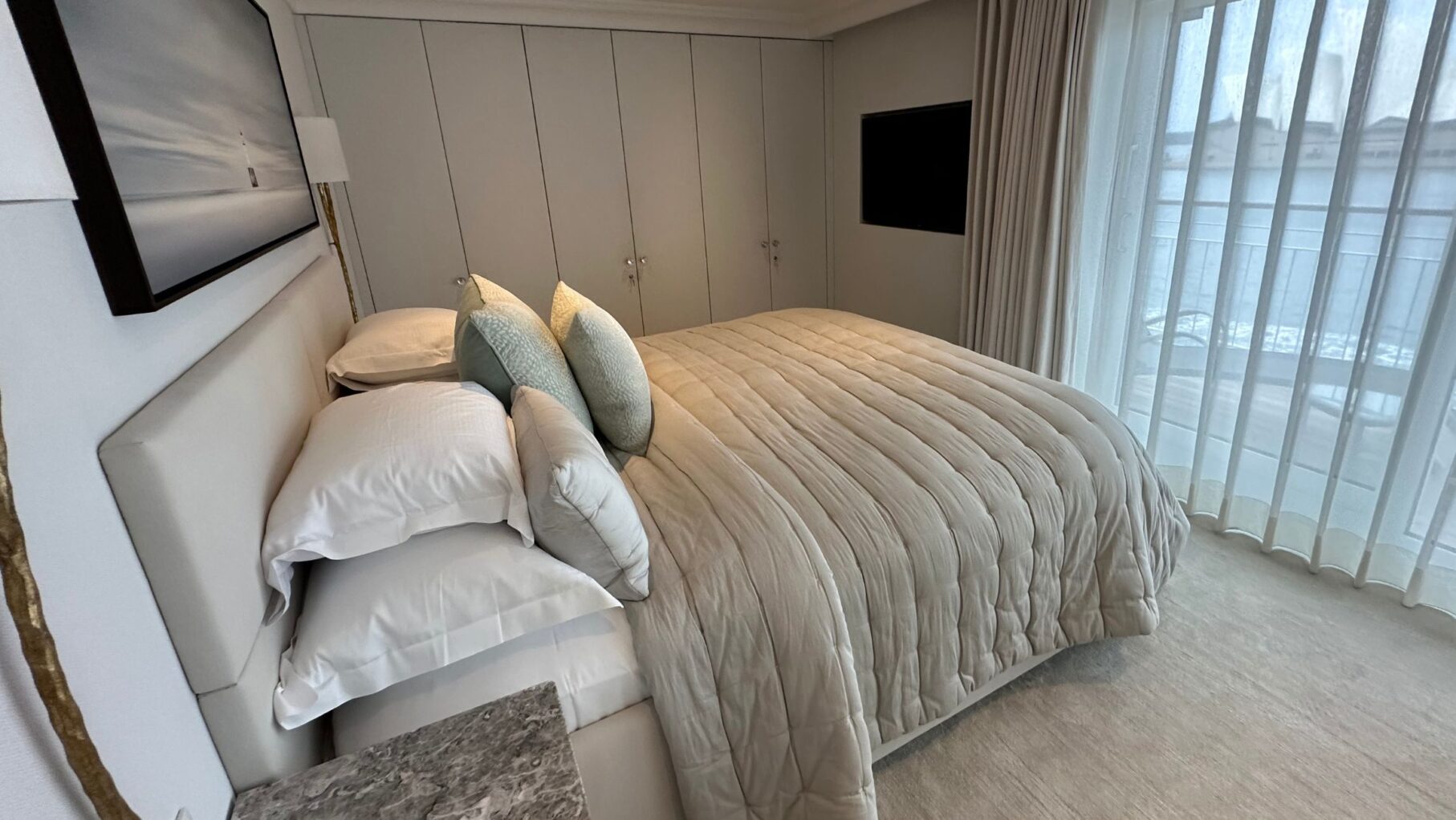 One of the bedrooms on a two-bedroom suite on The World