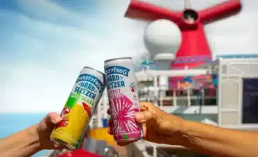 Two people drinking onboard a Carnival Ship