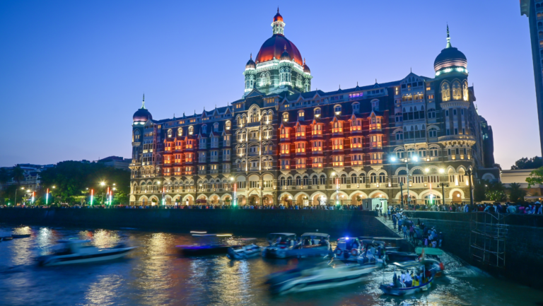 Taj Mahal Palace Hotel at twilight. Iconic Indian luxury hotel in Mumbai, India.