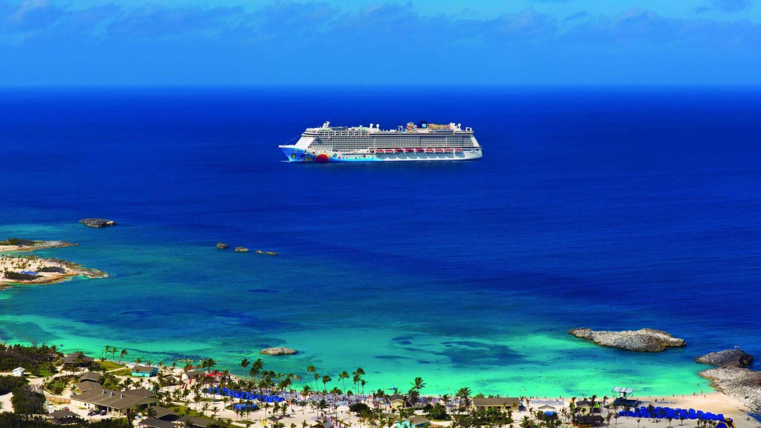 A Norwegian Cruise Line ship sailing the water in the Caribbean