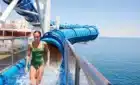 A woman on the Pacific Adventure with the waterslide in the background
