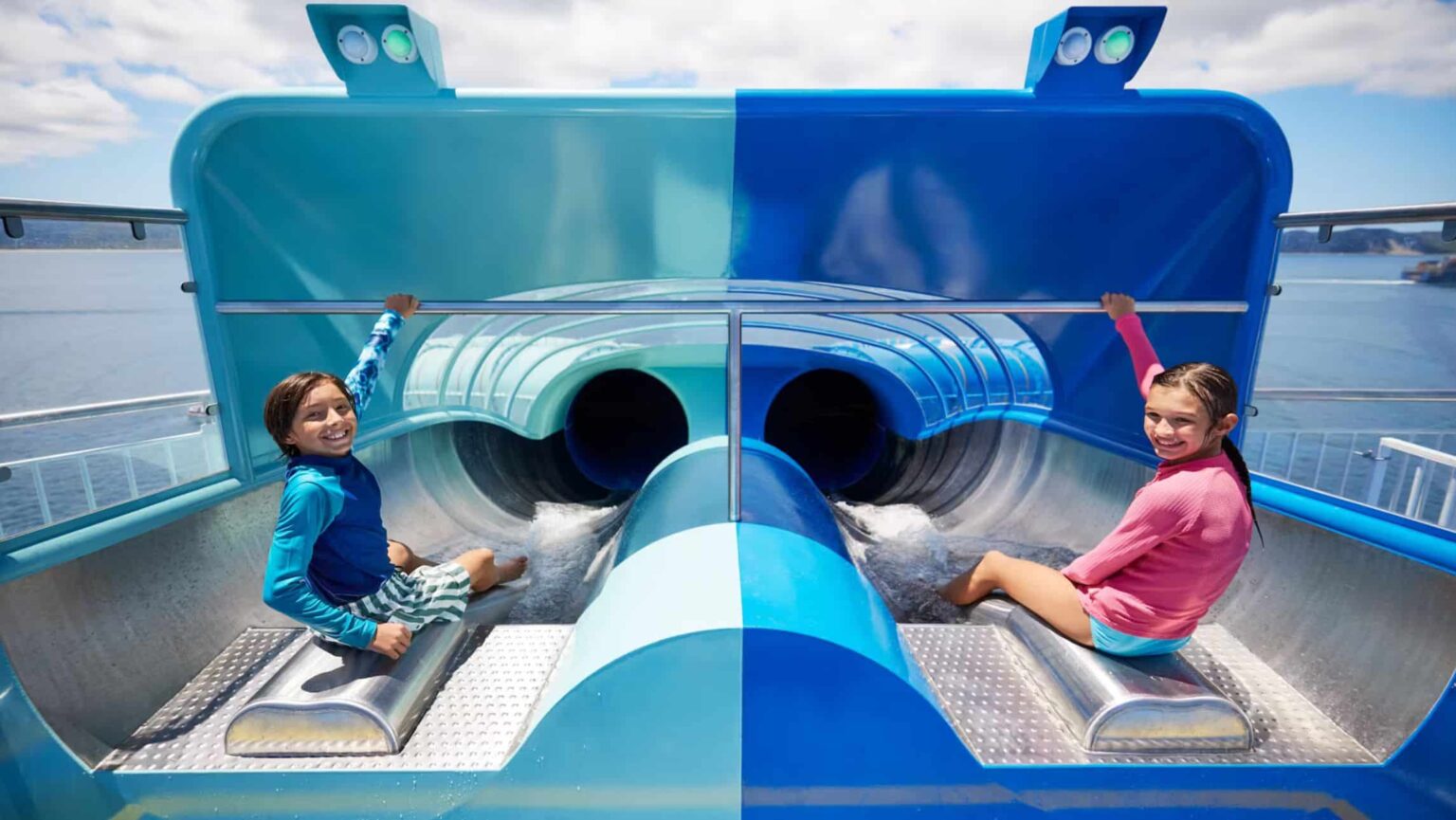 Two kids on a water slide