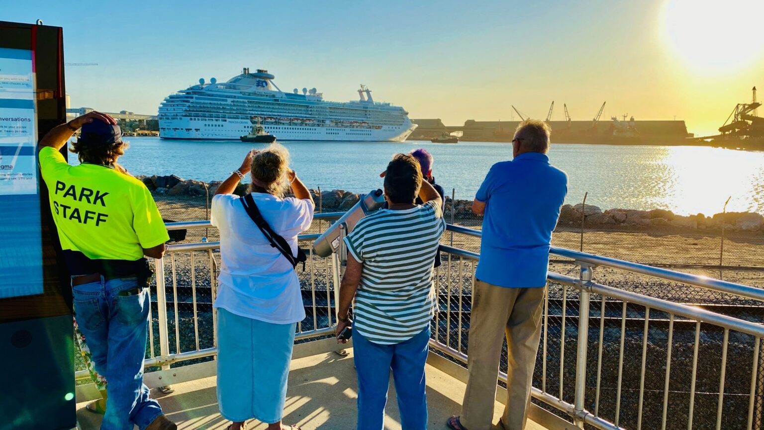 People watching cruise ship leave