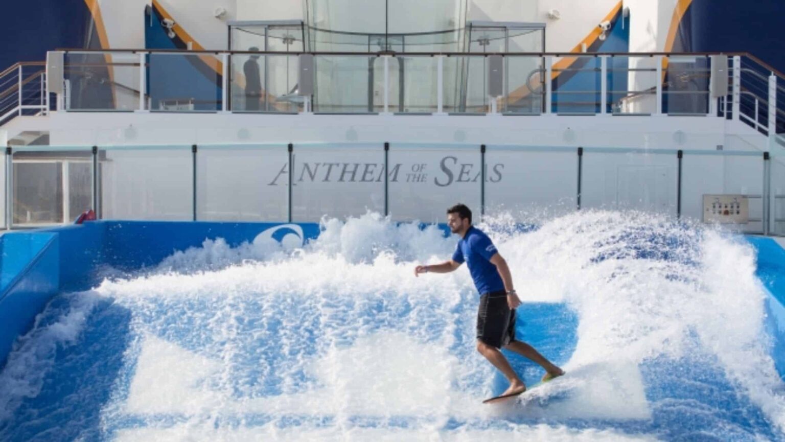 A man surfs on Anthem of the Seas