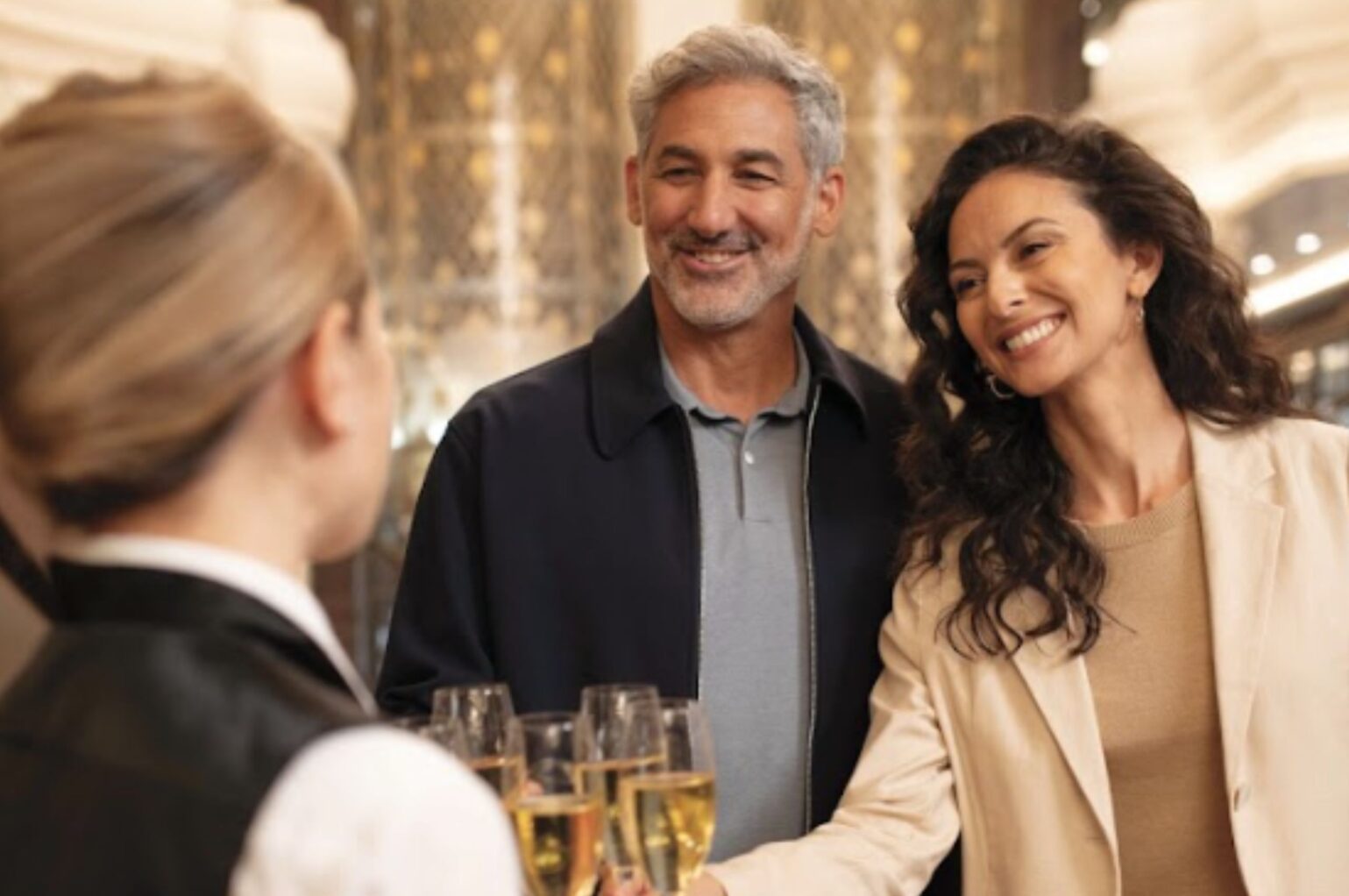 Couple on luxury cruise are offered champagne
