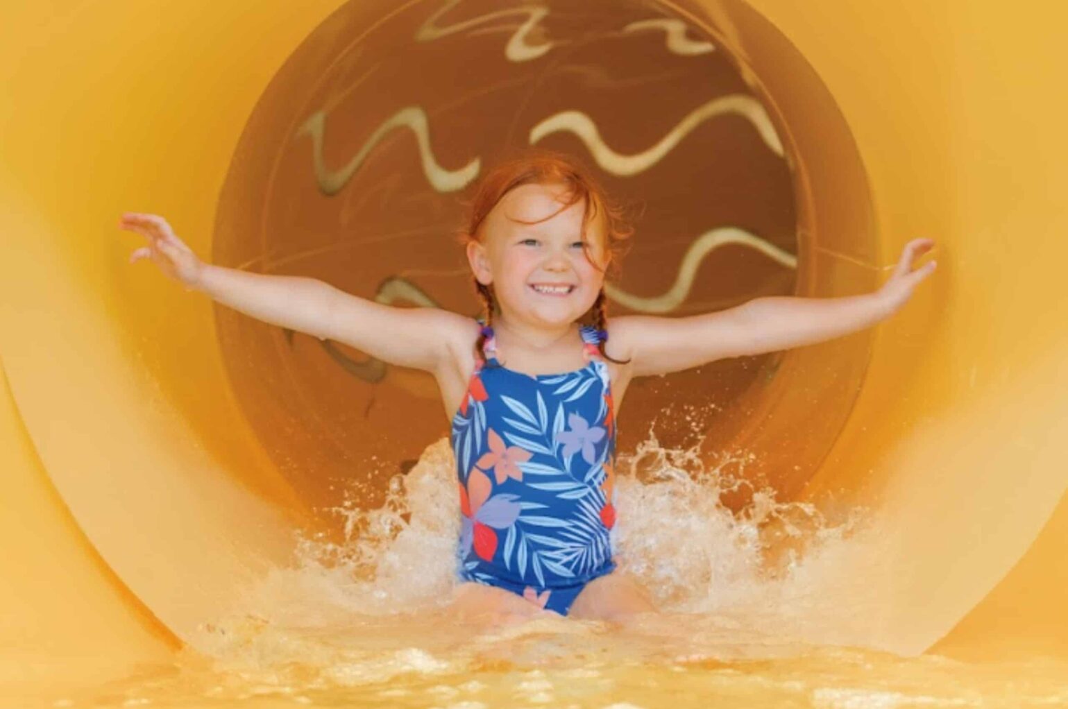 A child goes down Royal Caribbean's Perfect Storm waterslide
