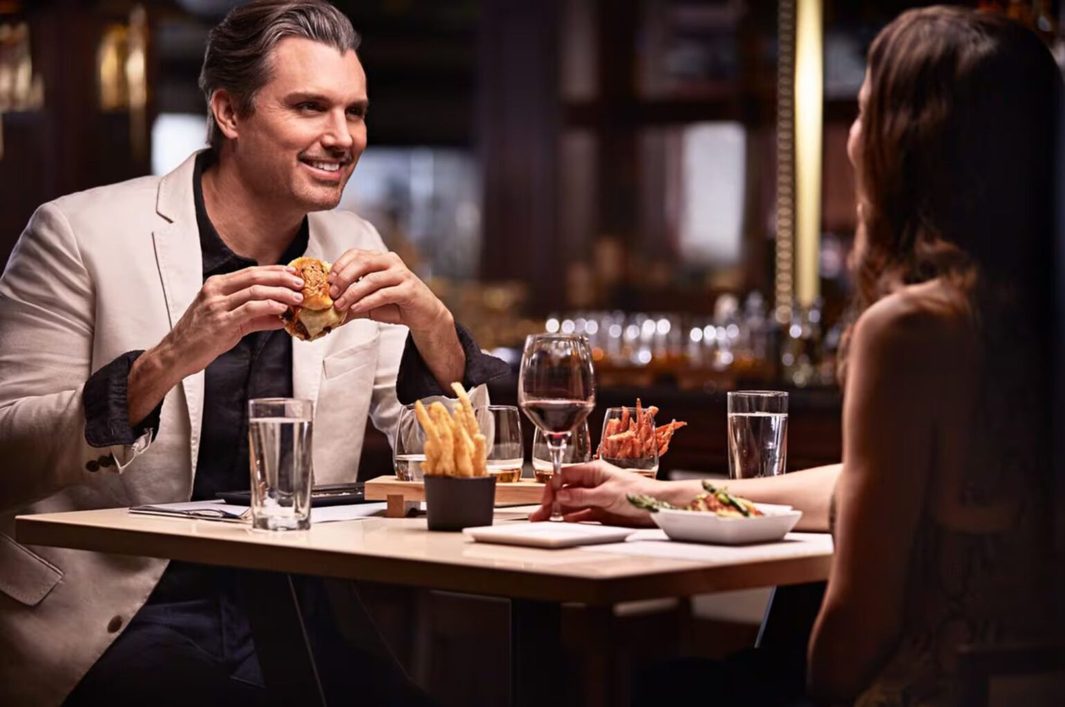 Diners enjoy burgers and chips at the Salty Dog Gastropub