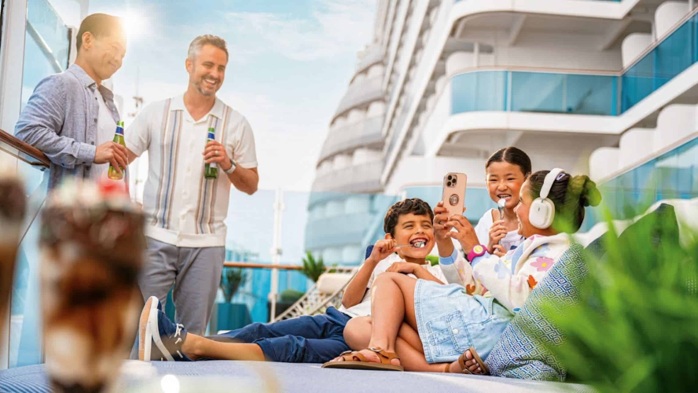 A family have fun on a Royal Caribbean cabana deck loyalty program