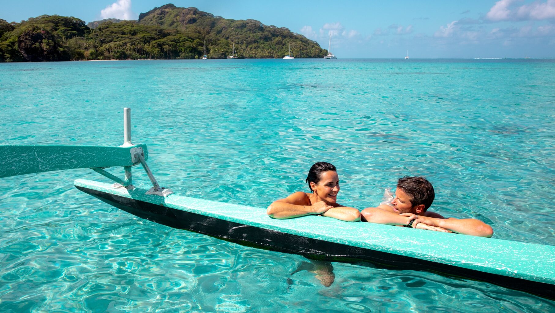 A couple in the ocean in Polynesia