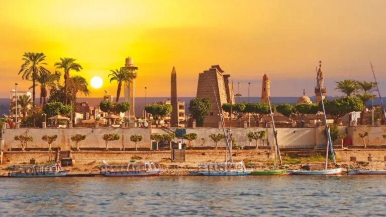 city by the river bank Luxor from a distance