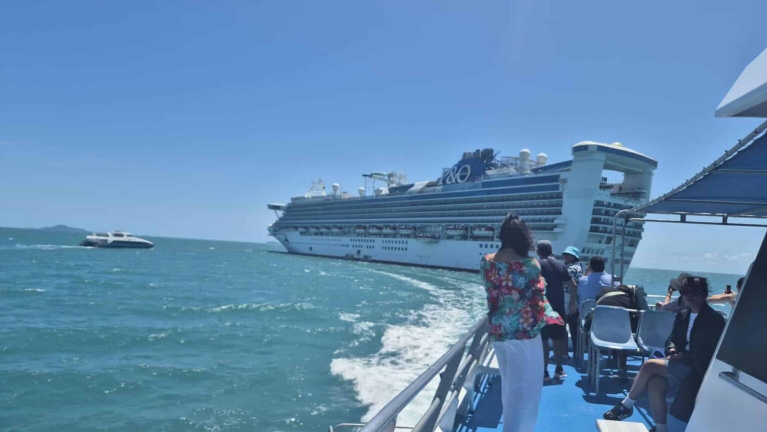 Passengers travelling on Pacific Encounter heading back to the ship in Airlie Beach