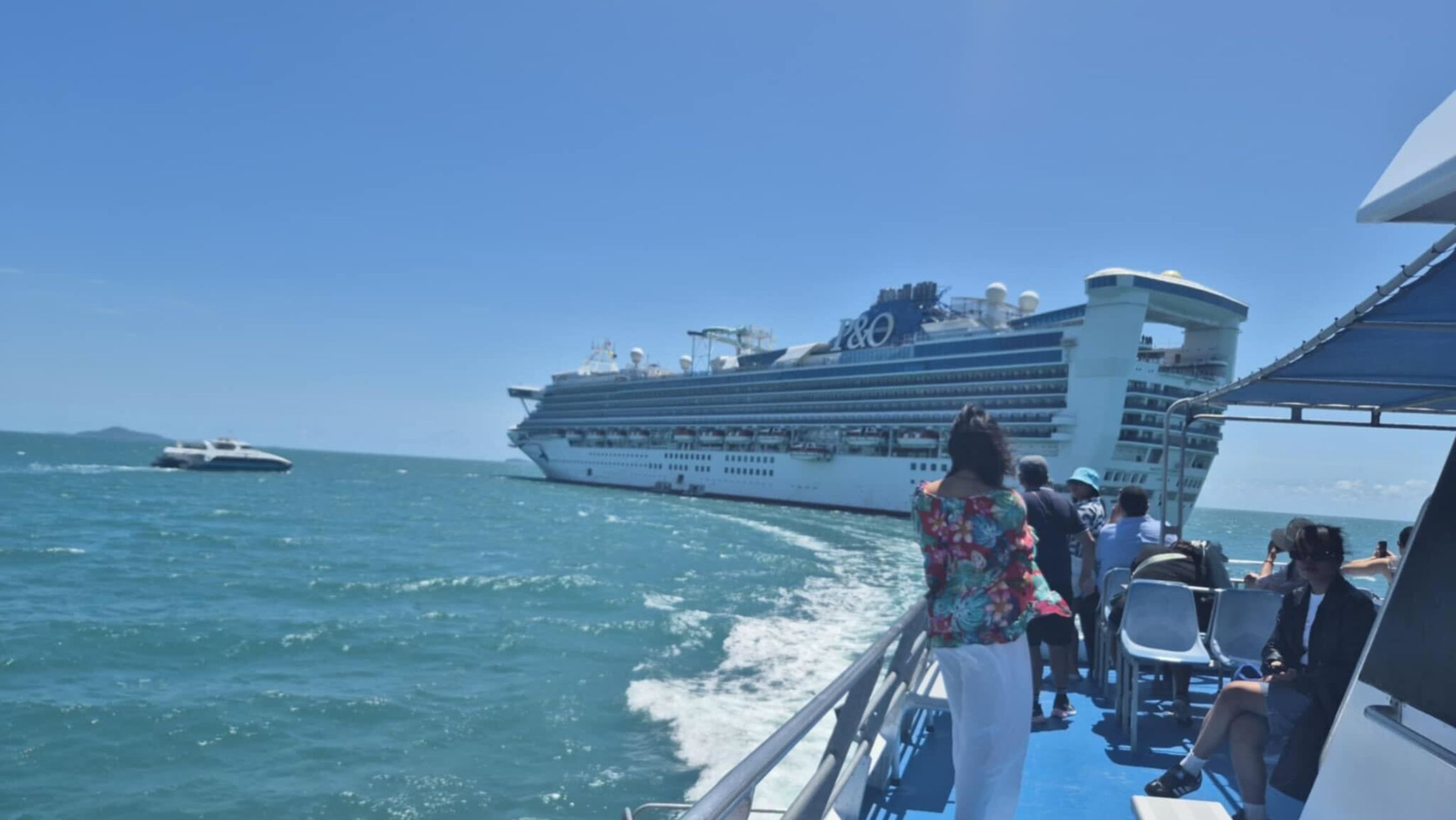 Passengers travelling on Pacific Encounter heading back to the ship in Airlie Beach