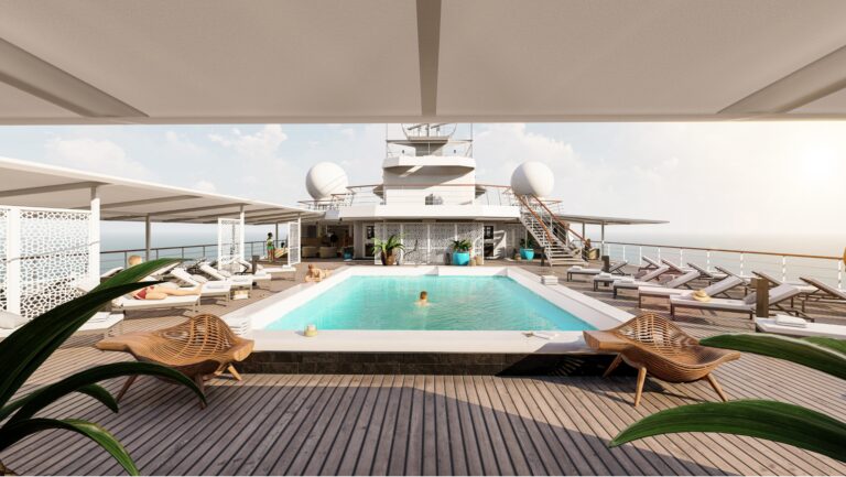 The pool deck on refurbished Paul Gauguin with its new white chaise loungers