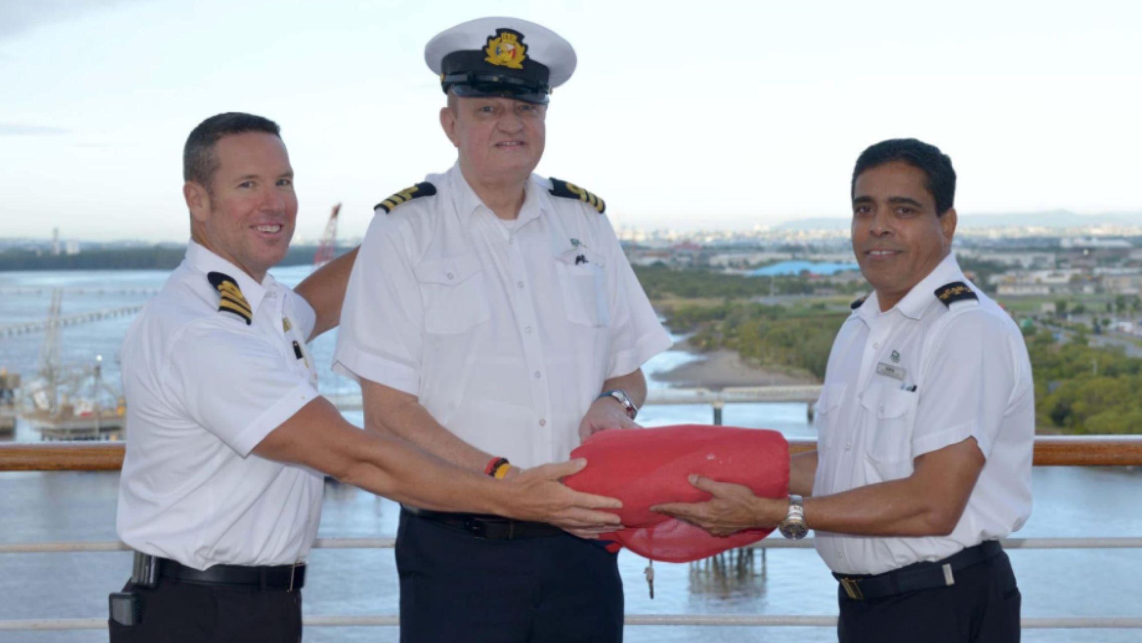 crew members wrap up the red flag of P&O at closing of P&O australia