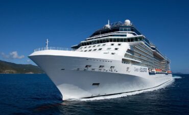 Celebrity Solstice ship in the ocean cruising in front of the camera