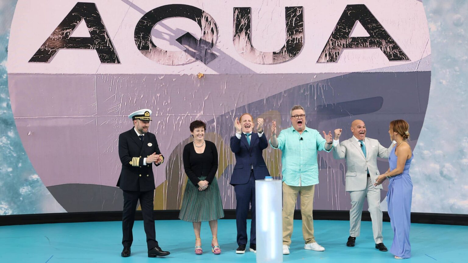 Eric Stonestreet, Emmy Award Winner and godfather to the new Norwegian Aqua™, joins (from left to right) Robert Lundberg, Captain of Norwegian Aqua™; Stella David, NCLH Chairperson of the Board; Harry Sommer, President and CEO of Norwegian Cruise Line Holdings Ltd®; Norwegian Cruise Line® President David J. Herrera; and Allison Hueman, hull artist for Norwegian Aqua™ in Miami to officially name and christen the first ship in the Prima Plus Class.