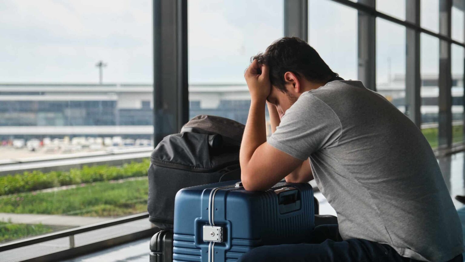 sad man in airport