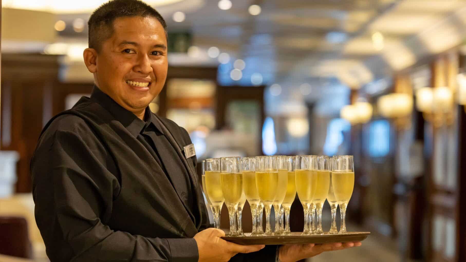 staff welcomes guests onboard