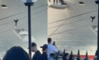 Man trying to climb Carnival Adventure