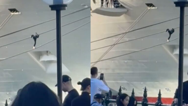 Man trying to climb Carnival Adventure