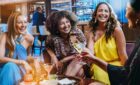 A group of women drinking onboard a Princess ship with cocktails