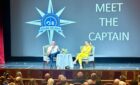 The captain onboard the Crown Princess giving passangers an update on norovirus on the ship