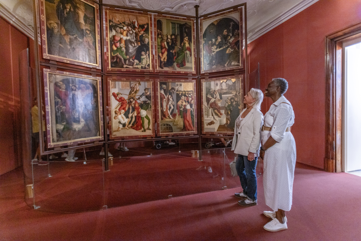 Two women looking at the artwork in the Melk Abbey and Library