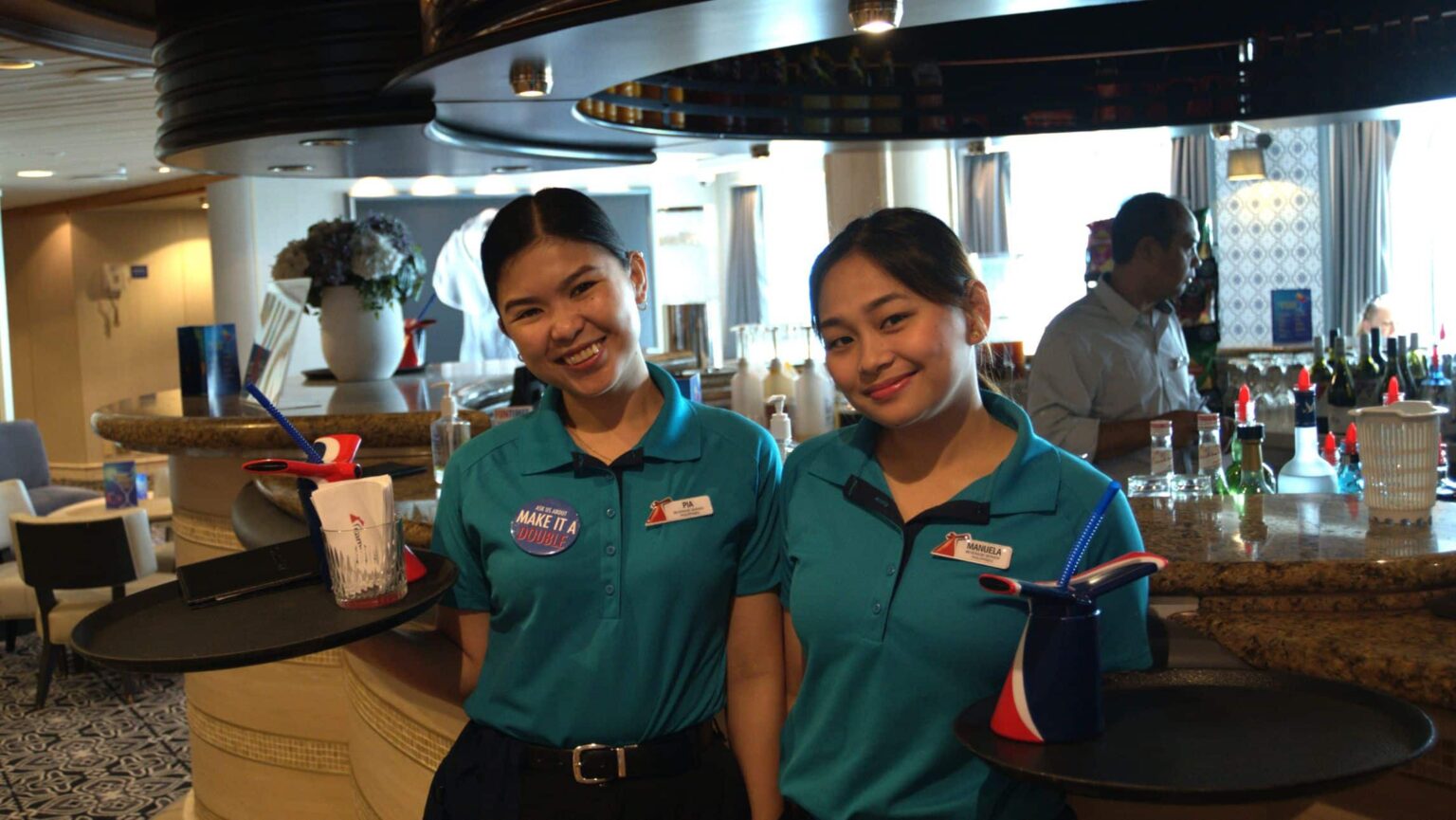 happy crew aboard the Carnival Encounter