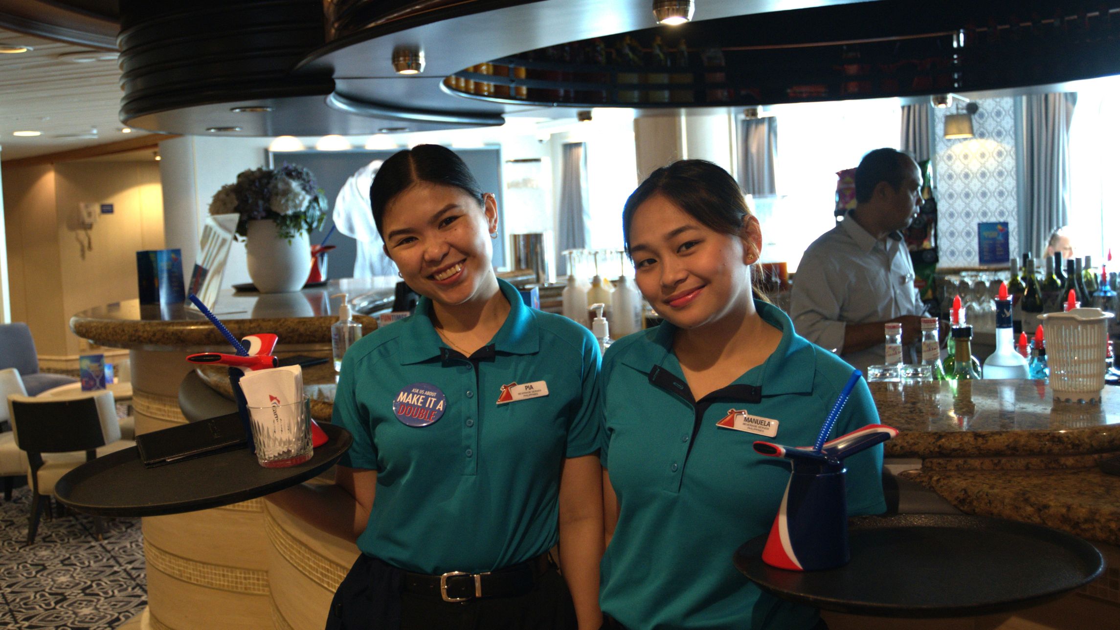 happy crew aboard the Carnival Encounter